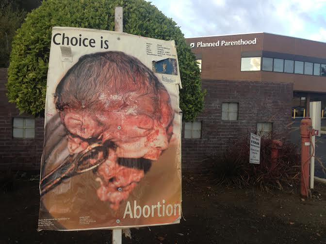 planned-parenthood-baby-rose-looking-at-pp-bldg