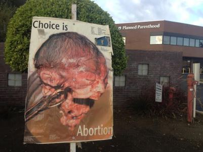 planned-parenthood-baby-rose-looking-at-pp-bldg