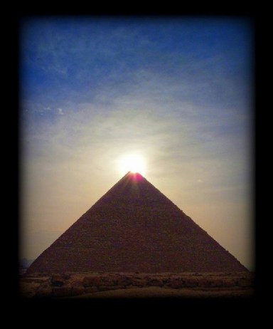 great pyramid giza with sunlight at the top